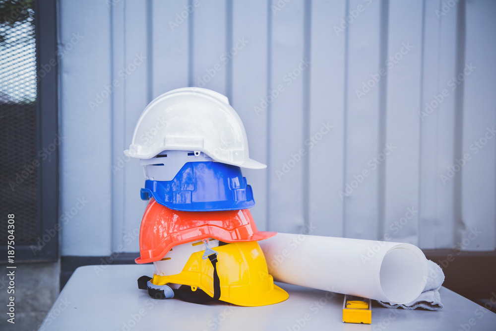 Fototapeta premium Safety helmet stacking on the table at the construction site