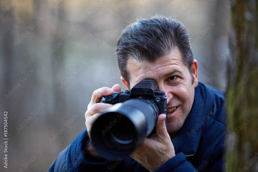 Fototapeta premium Photographer with camera outdoor