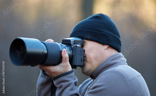 Photographer with camera outdoor