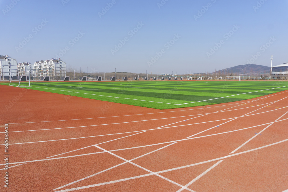 Fototapeta premium Track and field red plastic runway