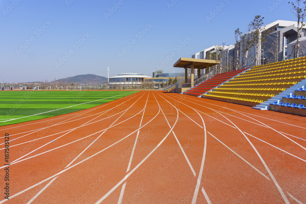 Fototapeta premium Track and field red plastic runway