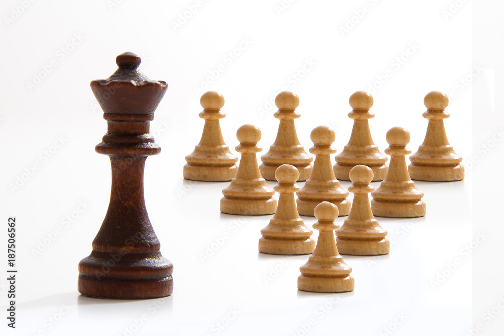 Business concept - chess - evil king and good employees - competition Business concept - chess - evil king and good employees - competition