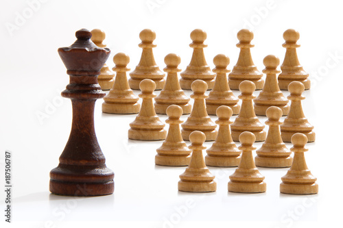 Business concept - chess - evil king and good employees - competition
