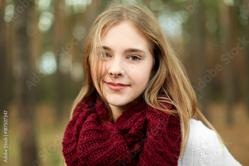 Portrait of beautiful smiling young woman outdoors