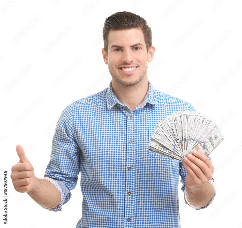 Handsome young man with money showing thumb up gesture on white background Handsome young man with money showing thumb up gesture on white background