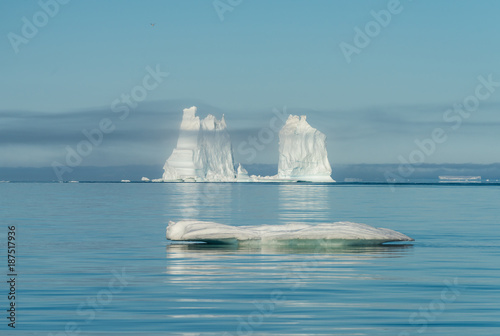 Mountain-size icebergs floating near the mouth of the Icefjord, Disko Bay, Greenland