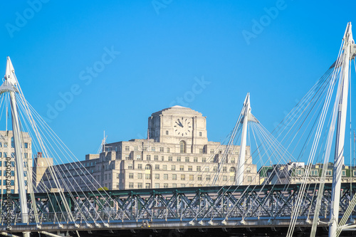 Golden Jubilee Bridges, a pedestrian footbridge, with Shell Mex House in the background