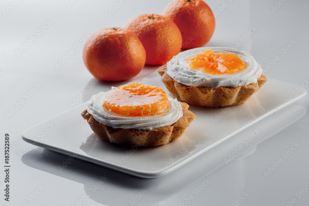 tartlets with cream and tangerines