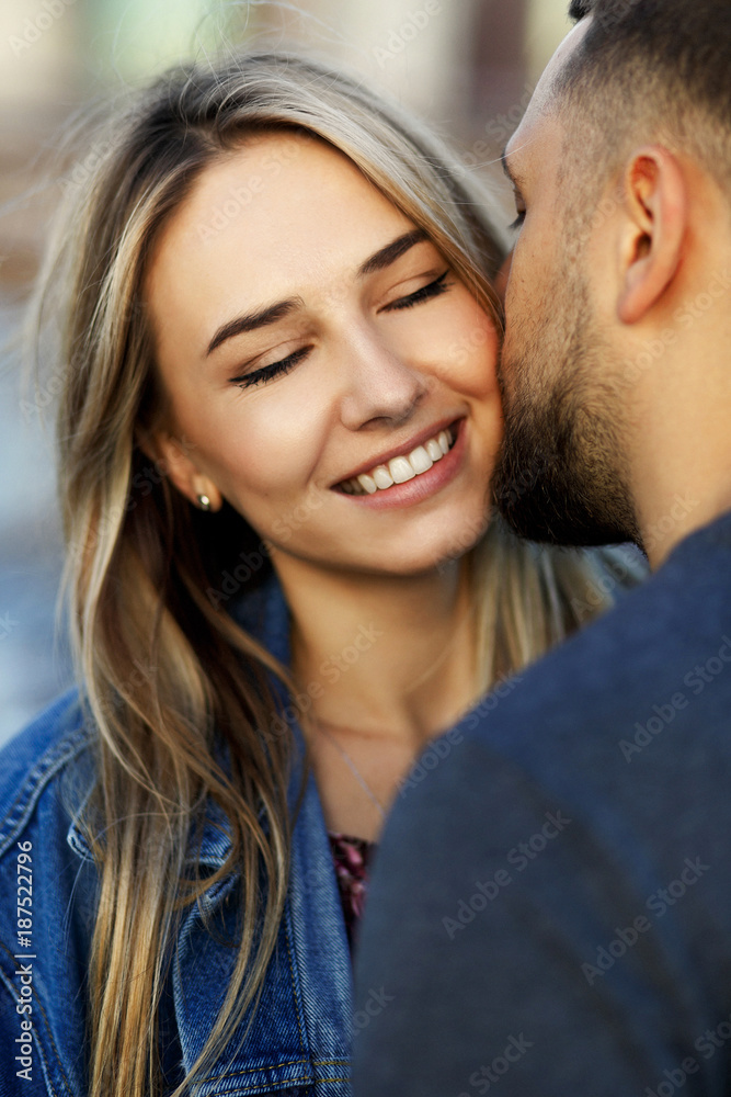 Lovely young couple dressed in casual style walks around Soho and New York city in morning lights