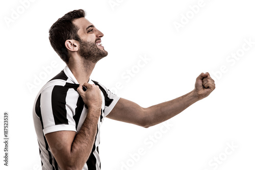 Soccer fan celebrating on white background photo