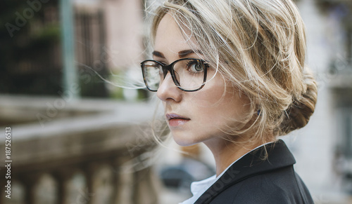 Portrait of beautiful blonde woman in glasses