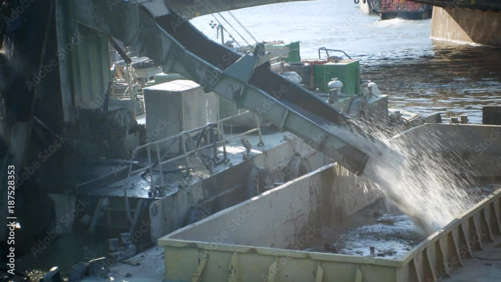 Untitled ProjectAUG.15,2017. Russia,Saint Petersburg; Dredging River : Crane scoops sand and mud from river bottom Untitled ProjectAUG.15,2017. Russia,Saint Petersburg; Dredging River : Crane scoops sand and mud from river bottom