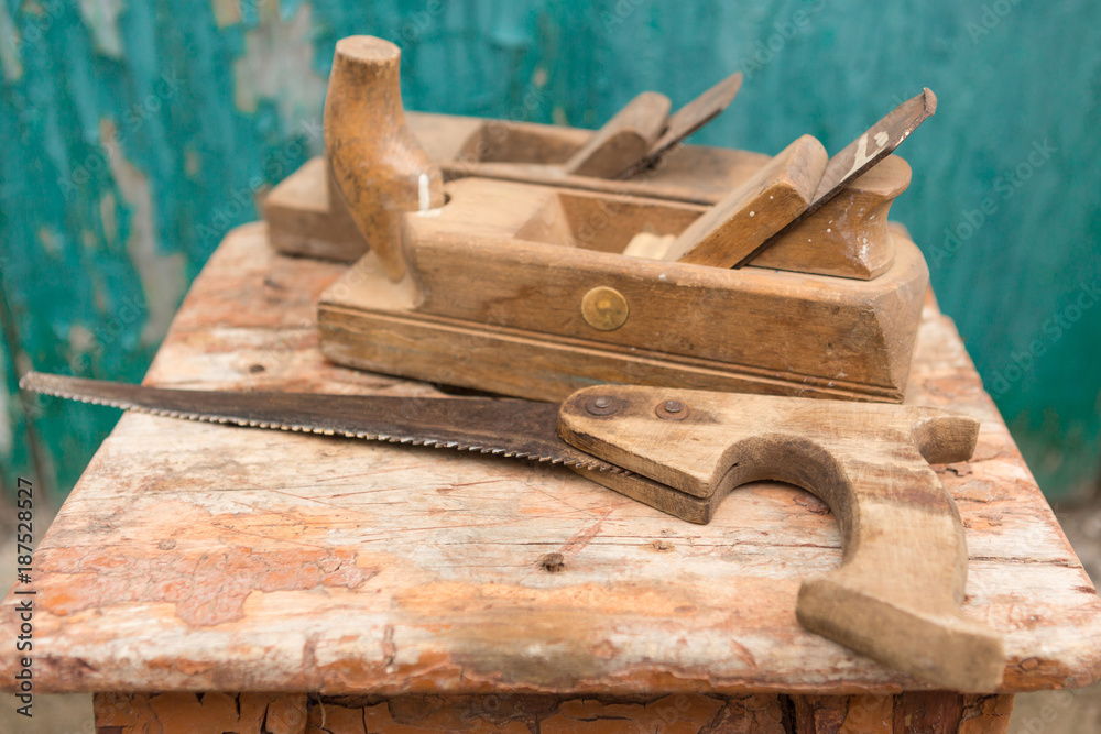 tools on an old wooden table, woodwork, cracks and scratches tools on an old wooden table, woodwork, cracks and scratches