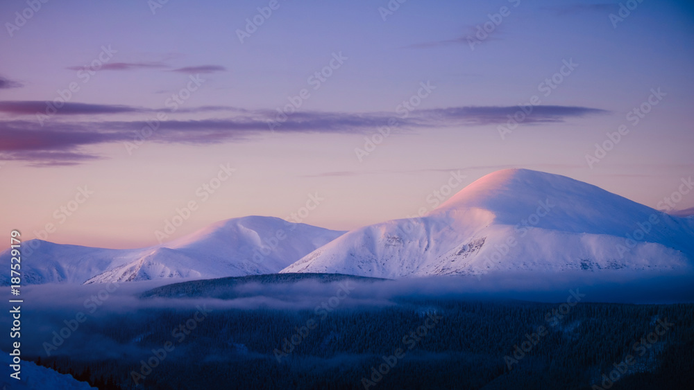 Goverla winter mountain in snow at sunrise