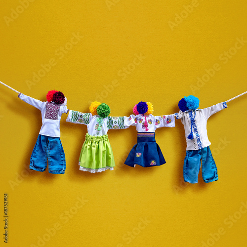Handmade textile dolls on background, traditional ukrainian folk rag doll Motanka in ethnic style, ancient culture folk crafts tradition of Ukraine. Most Popular Souvenirs From Ukraine.