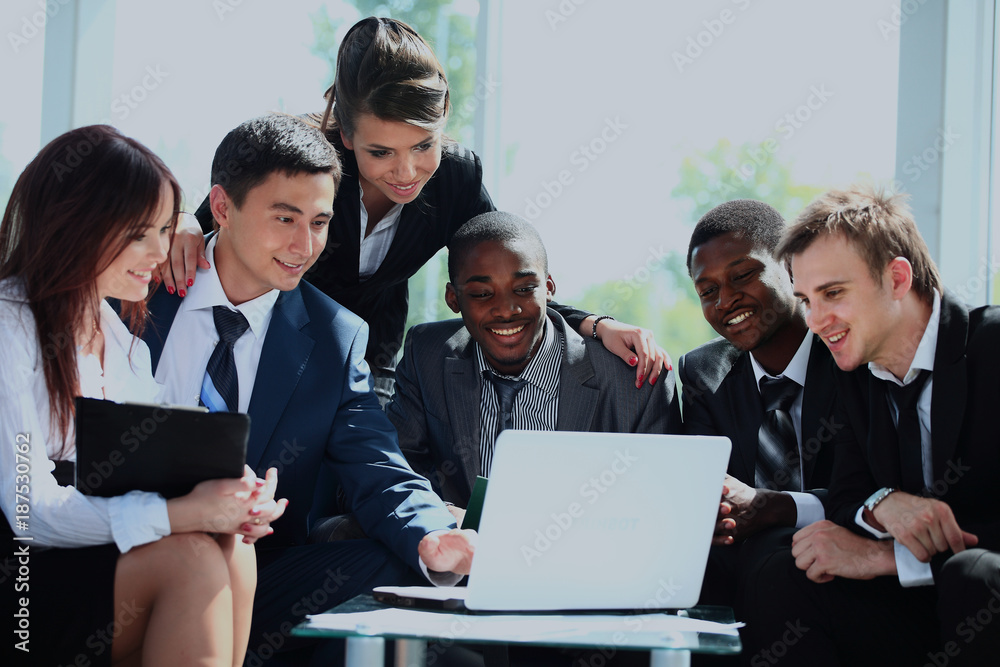 Happy working business team in modern office. Happy working business team in modern office.
