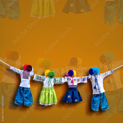 Handmade ukrainian textile dolls on background, traditional folk rag doll Motanka in ethnic style, ancient culture folk crafts tradition of Ukraine. Most Popular Souvenirs From Ukraine.