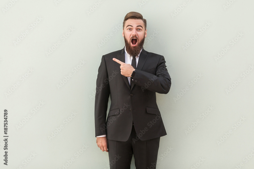 Handsome presenter of your advertisement. Happy young man in formalwear Handsome presenter of your advertisement. Happy young man in formalwear