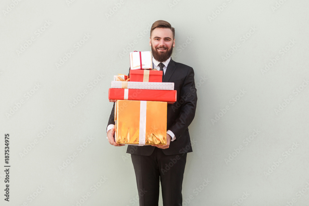 It's many gift boxes for you! Happiness businessman toothy smile It's many gift boxes for you! Happiness businessman toothy smile