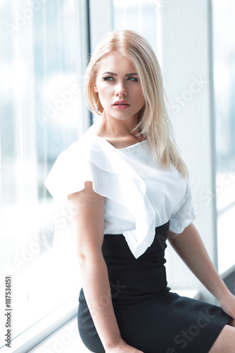 Free Download modern business woman sitting near the window in the office. - GFXLoad