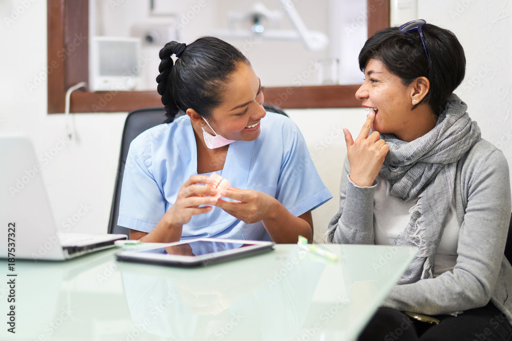 Dentist and patient discussing treatment options Dentist and patient discussing treatment options