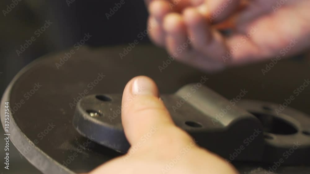 Hand assembling an electric hi-hat, tinkering with wires. Hand assembling an electric hi-hat, tinkering with wires.