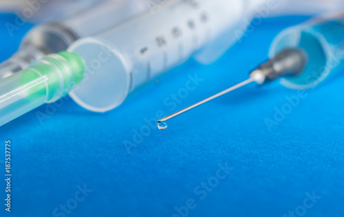 Syringe. Syringe on blue background