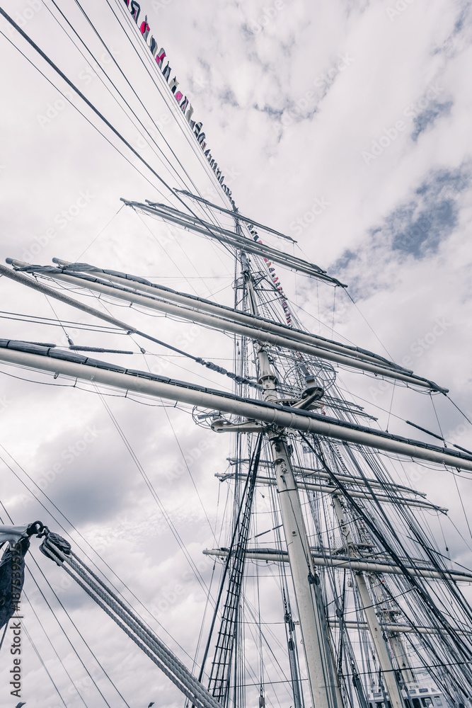 Old sailing ship mast. Tall ship rigging detail. Masts and rigging of a sailing ship Old sailing ship mast. Tall ship rigging detail. Masts and rigging of a sailing ship