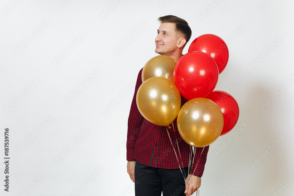 Handsome caucasian smiling fun young happy man 25-30 years in red plaid shirt with yellow golden balloons, celebrating birthday, on white background isolated for advertisement. Holiday, party concept. Handsome caucasian smiling fun young happy man 25-30 years in red plaid shirt with yellow golden balloons, celebrating birthday, on white background isolated for advertisement. Holiday, party concept.
