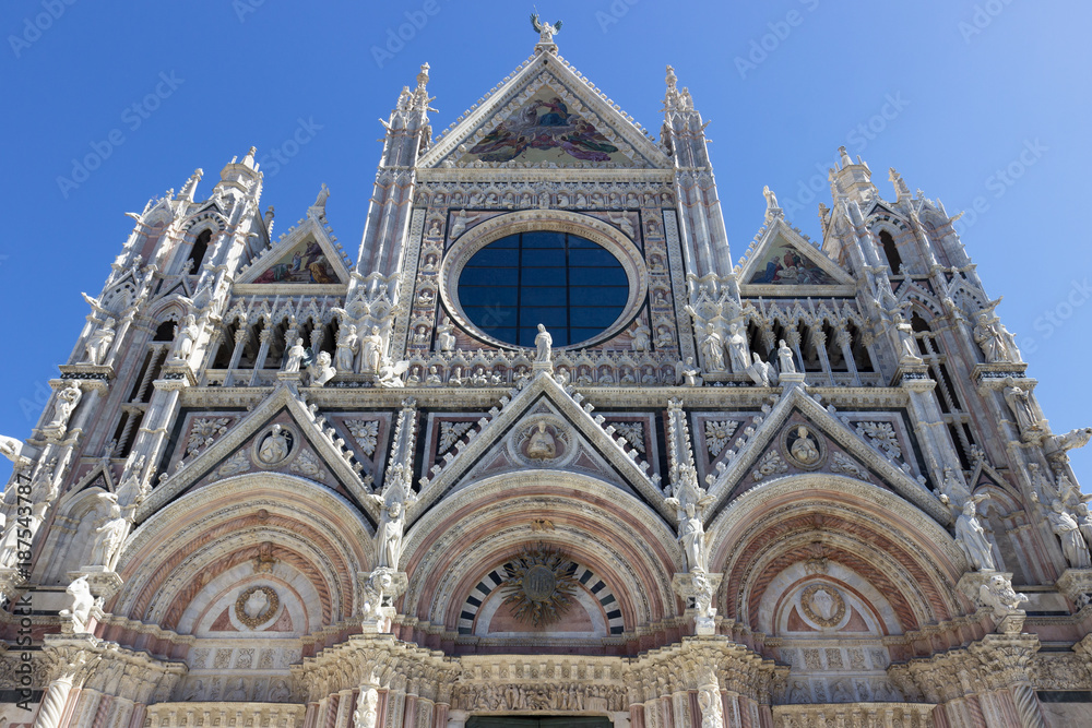 Detail of the facade of the metropolitan cathedral of Santa Maria Assunta in Siena, Italy