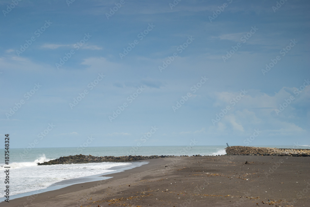 Pacific ocean beach in Champerico, Retalhuleu, Guatemala, Dramatic clouds and intense surge.