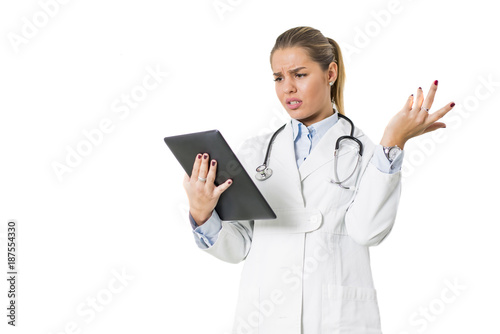 Pretty young female doctor with digital tablet