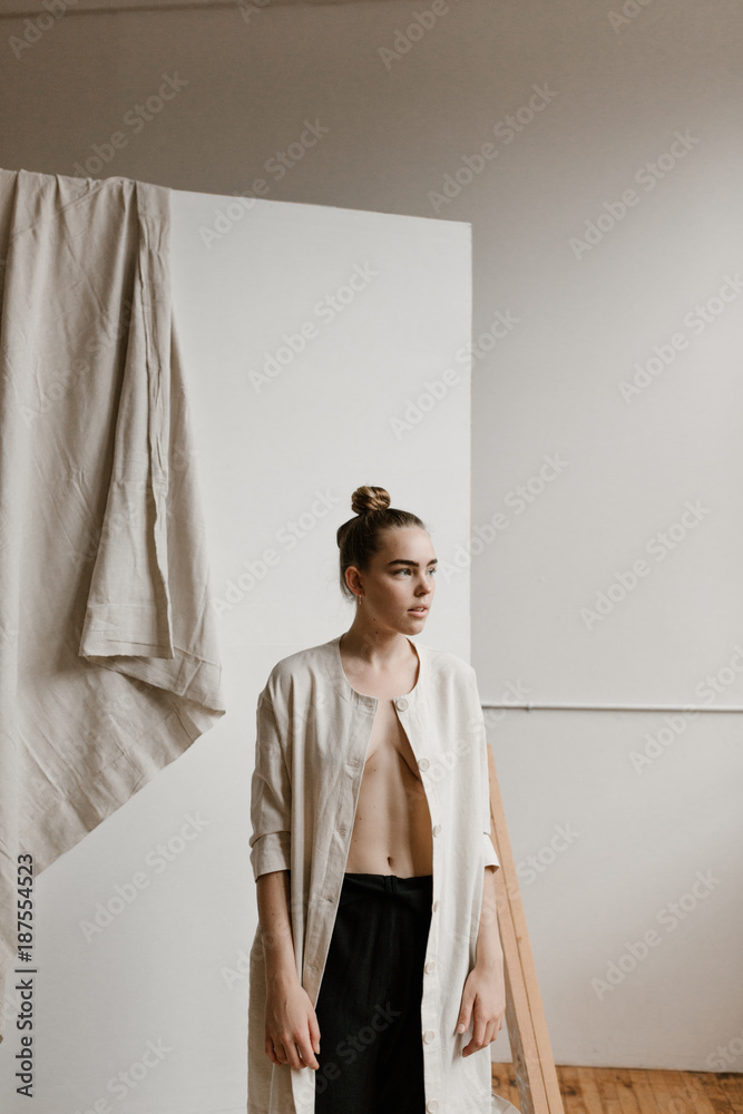 woman wearing open light jacket with nothing underneath Stock