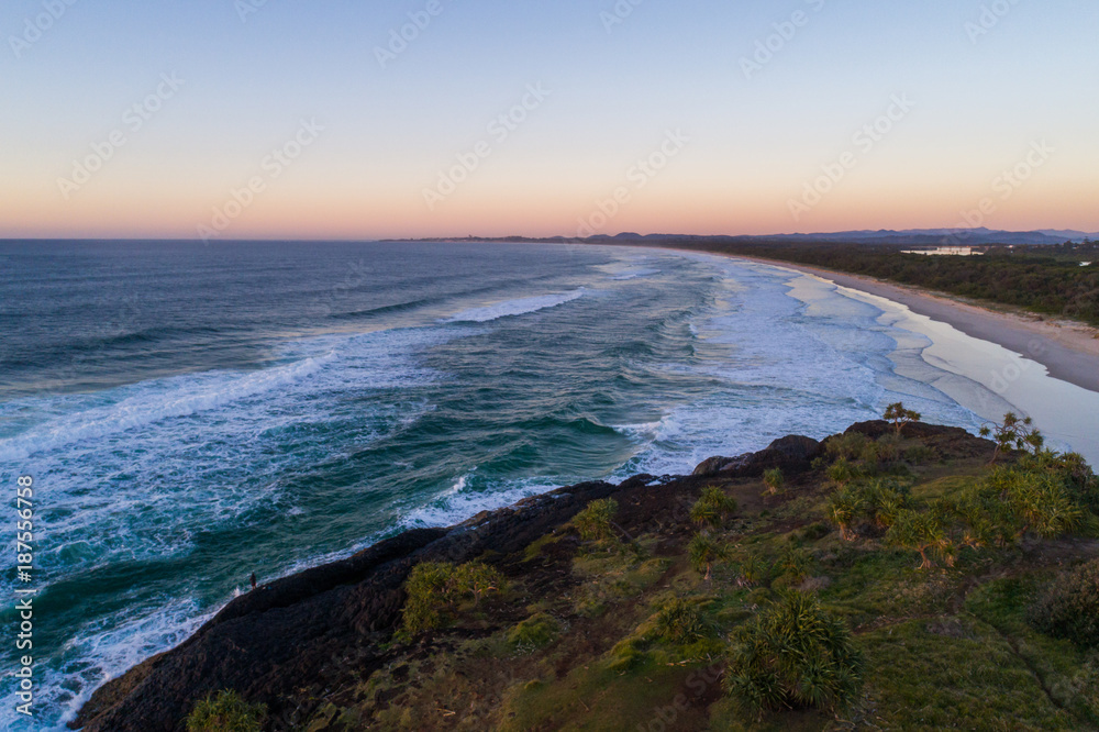 Aerial View over Fingal Head lighthouse at sunrise