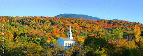 Iconic church in Stowe Vermont middle of fall foliage photo