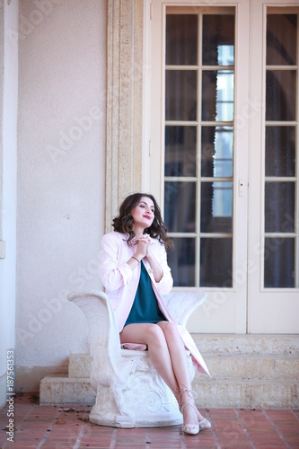 Portrait of stylish lady sitting
