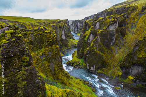 green mountain canyon with river in iceland