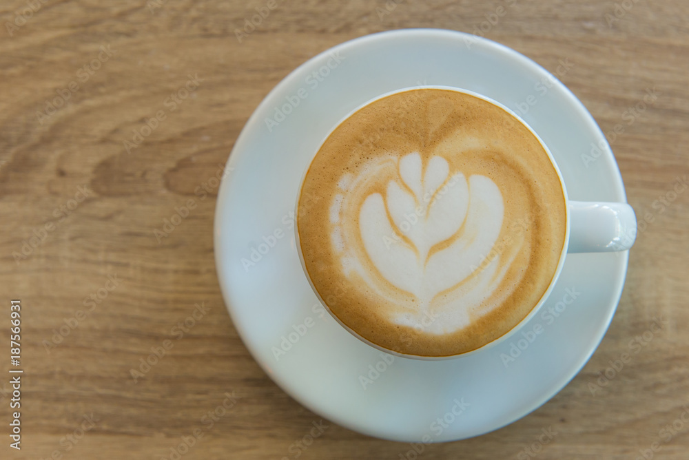 latte art coffee or cappuccino on wooden table background latte art coffee or cappuccino on wooden table background
