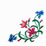 Embroidery pattern of flowers handmade smooth thread of floss on white background isolate with copy space flat view from above