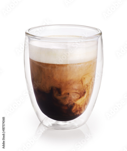 Fotografie Hot coffee with milk in a glass with double walls isolated on white background