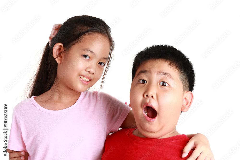 Two children stand shoulder to shoulder on white. Boys and girls Two children stand shoulder to shoulder on white. Boys and girls