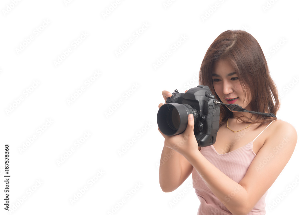 Portrait of beautiful asian woman holding and looking at her camera isolated on white background. Female photography holding camera. Free from copy space. Portrait of beautiful asian woman holding and looking at her camera isolated on white background. Female photography holding camera. Free from copy space.