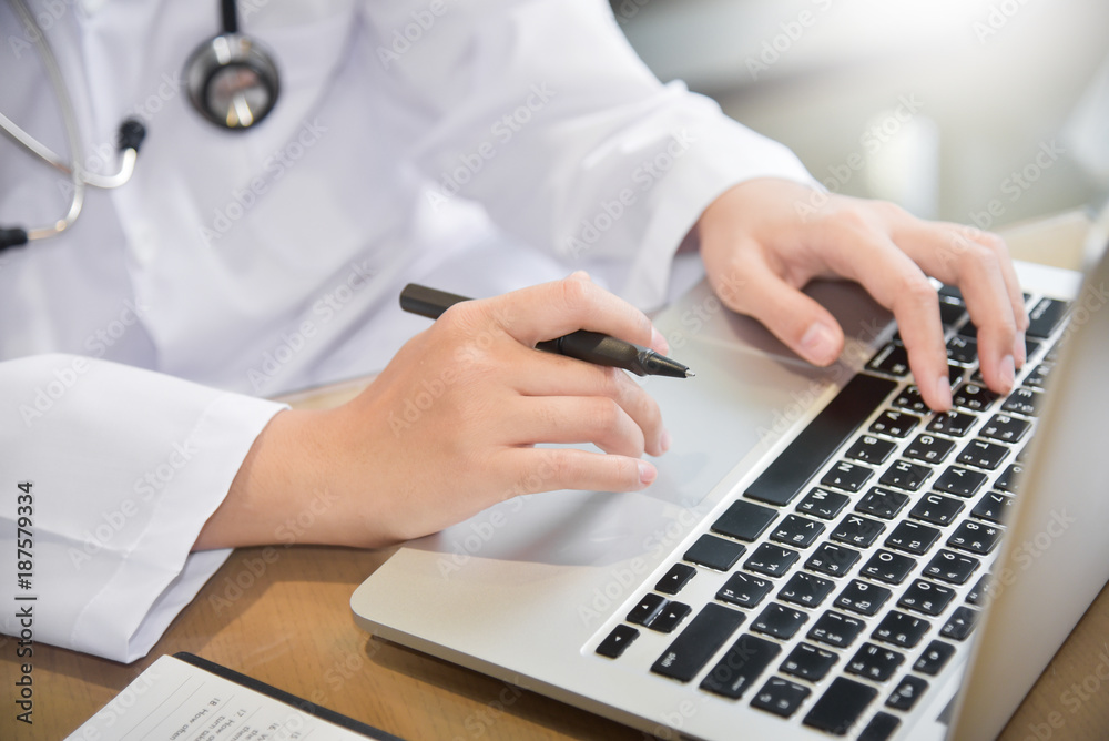 Fototapeta premium Female Doctor working with laptop.