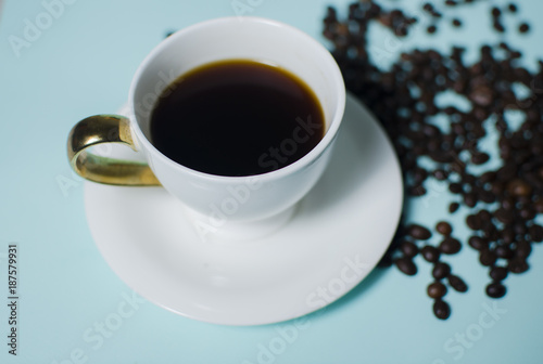 In a white cup, coffee is poured over a fried coffee fryer