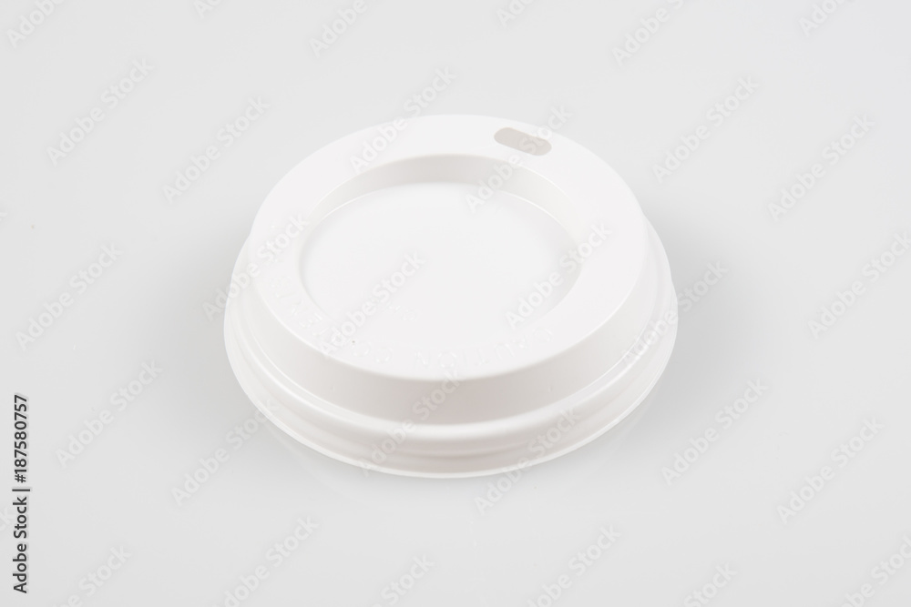 a plastic cover for a cardboard cup of a takeaway coffee a plastic cover for a cardboard cup of a takeaway coffee