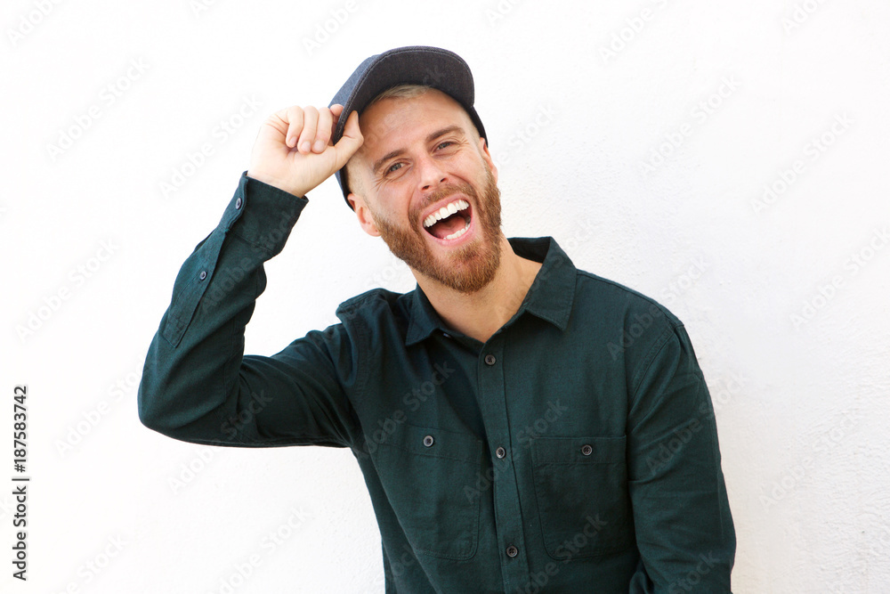 happy man with hat laughing against isolated white background