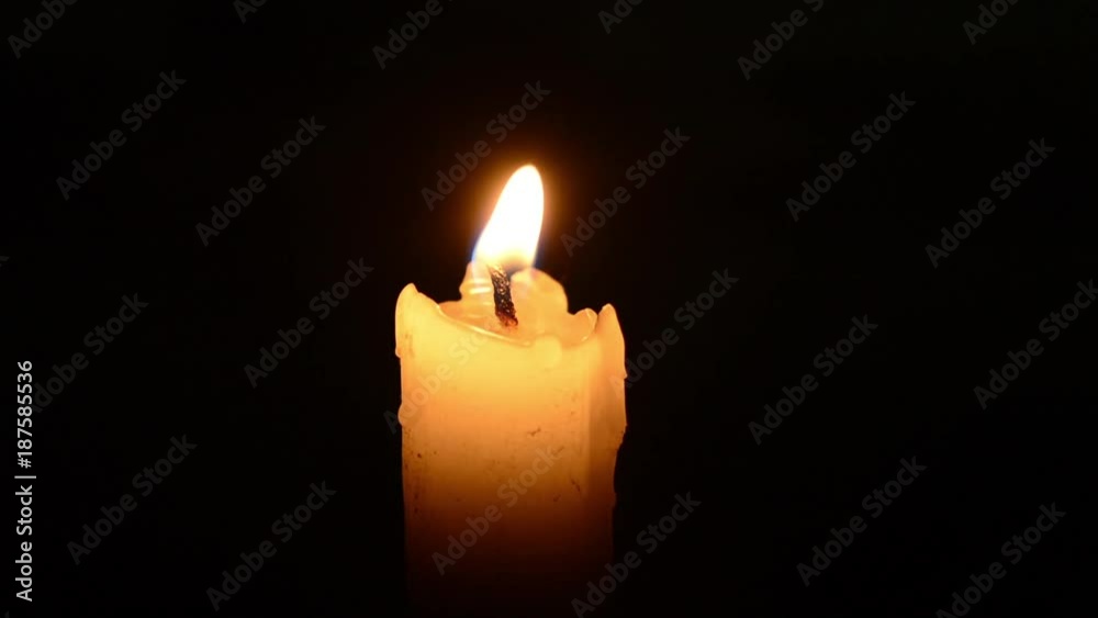 Single lit candle with quite flame Single lit candle with quite flame