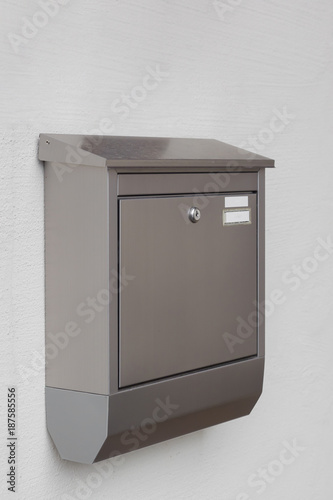 A silver mailbox on the wall