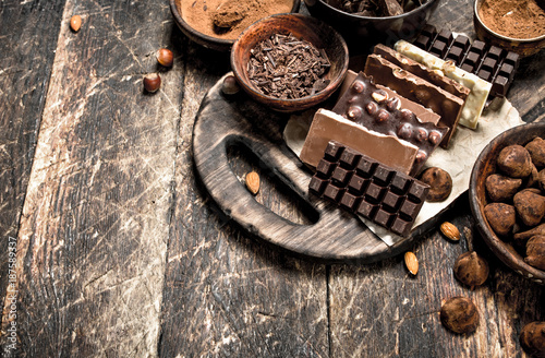 Chocolate bars with truffles and cocoa powder.