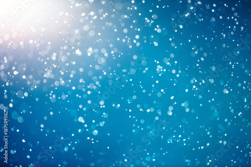 Snow bokeh texture on blue background